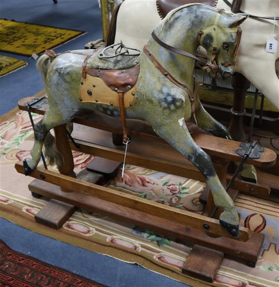 A late Victorian rocking horse on trestle base 107cm